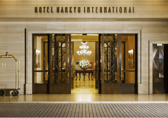 The elegant golden entrance of Hotel Hankyu International in Osaka standing for tradition and hospitality